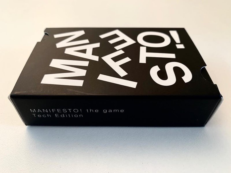 a box of a card game called 'manifesto'